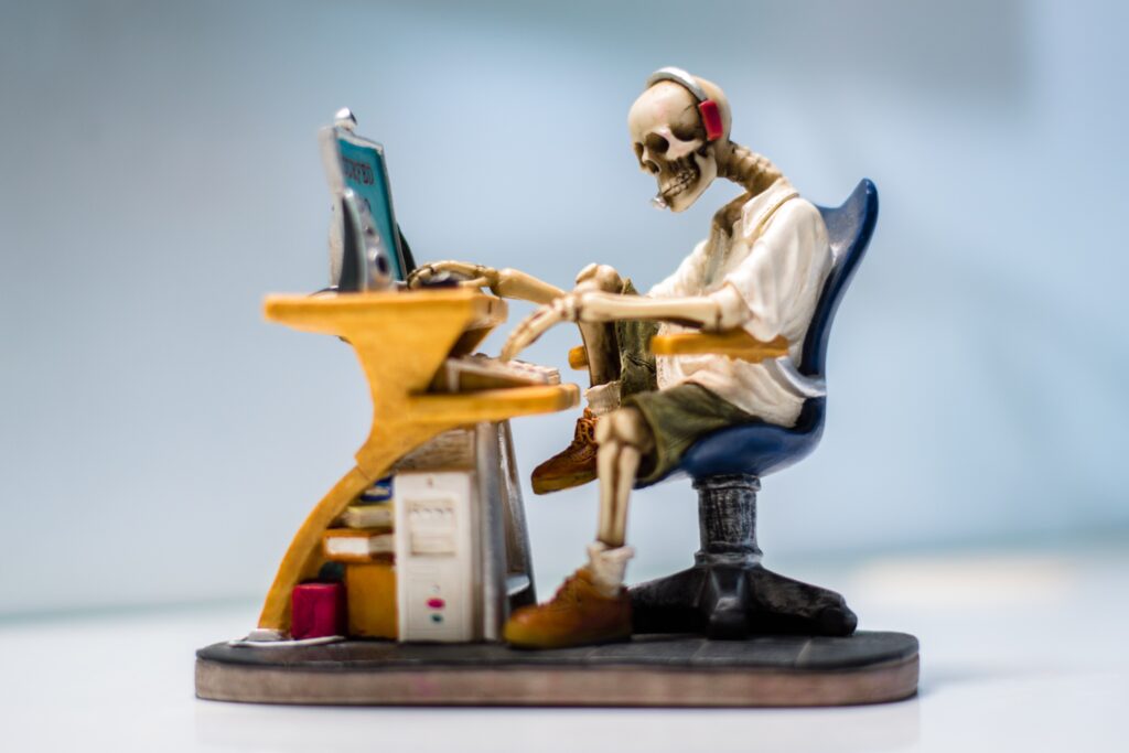 Human Skeleton working at a Desk